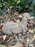 22nice4me Garden Statues brown concrete calf statue laying down in a garden setting with autumn leaves