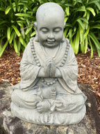 22nice4me Garden Statues blessing Buddha figurine in grey GRC concrete with an antique hand-painted finish.