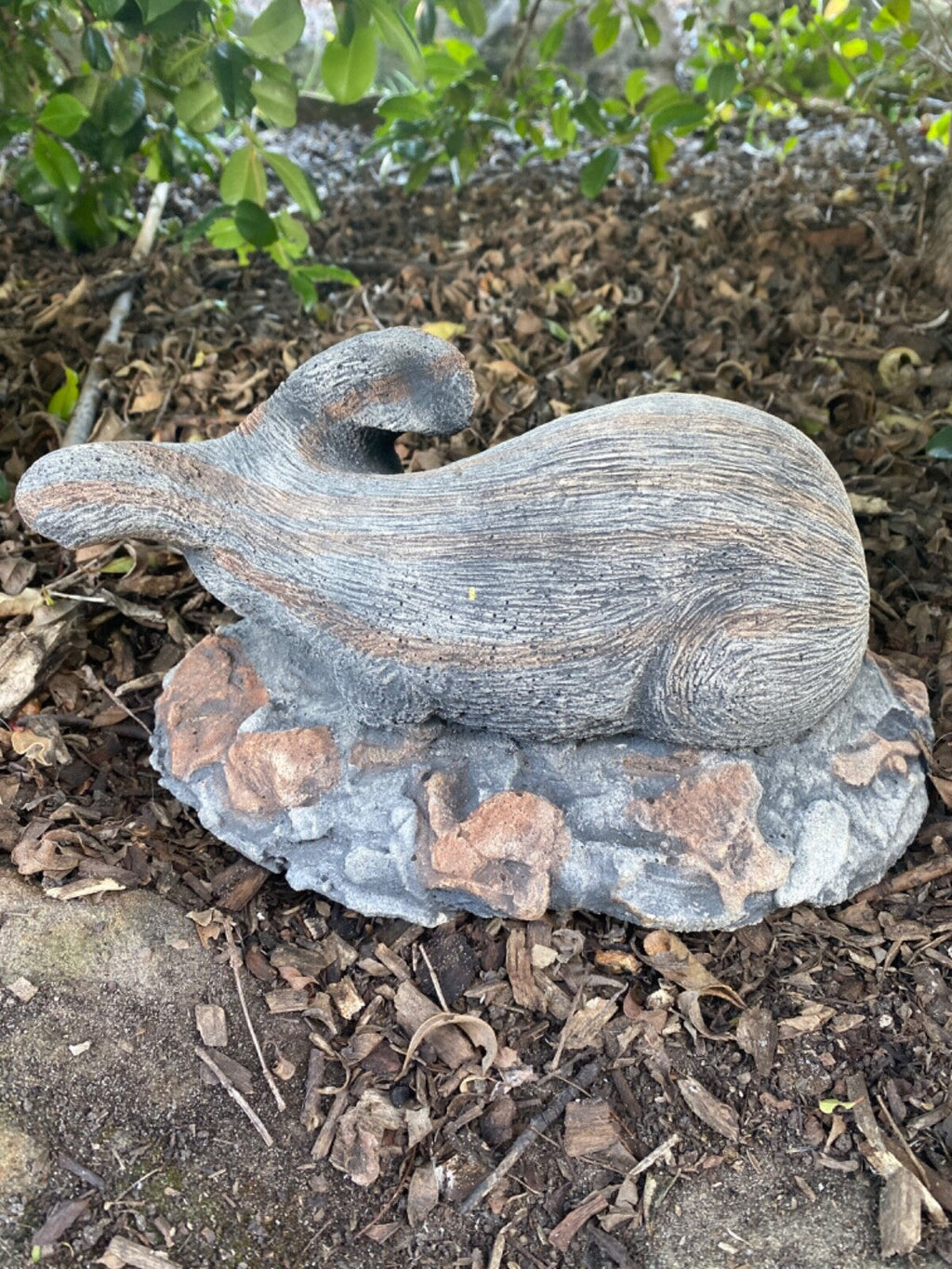 22nice4me Garden Statues hand-painted concrete bilby ornament with an antique finish resting on a textured rock base.