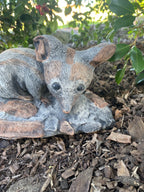 22nice4me Garden Statues hand-painted concrete bilby ornament with an antique finish resting on a rock in a garden
