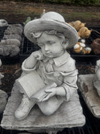 22nice4me Garden Statues concrete boy reading a book on a rustic bench, 62cm tall natural white garden ornament.