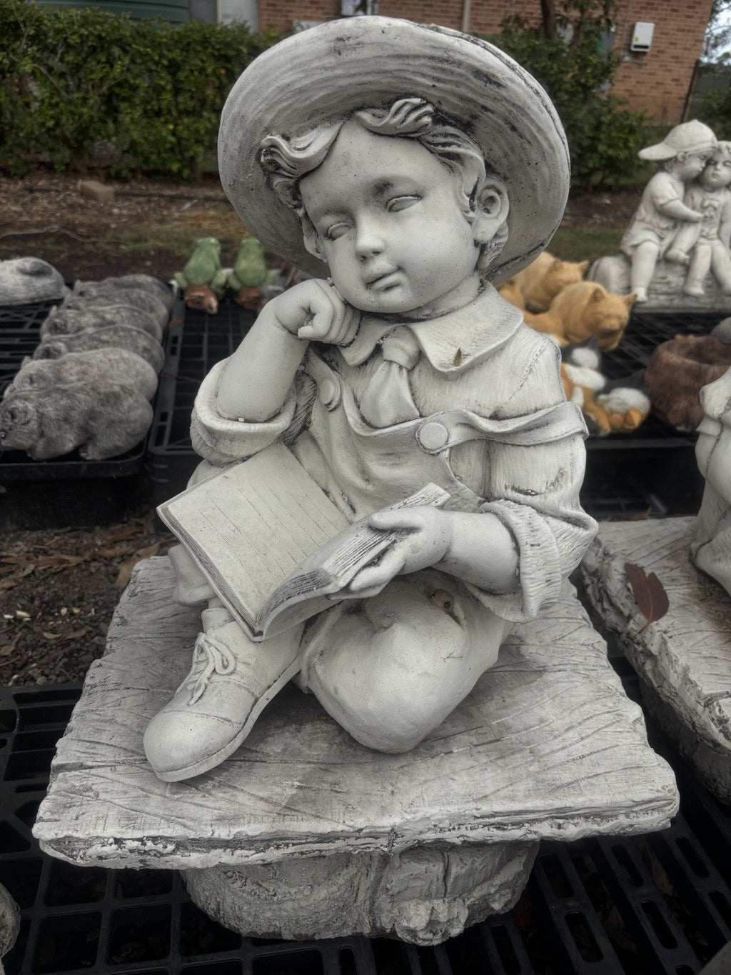 22nice4me Garden Statues concrete boy reading a book statue sitting on a rustic bench with detailed clothing
