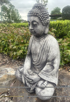 22nice4me Garden Statues concrete Buddha in meditation pose with a weathered grey finish in a garden setting