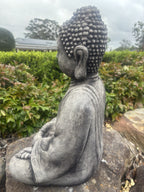 22nice4me Garden Statues concrete Buddha in meditation pose with weathered grey finish, side view in a garden setting.