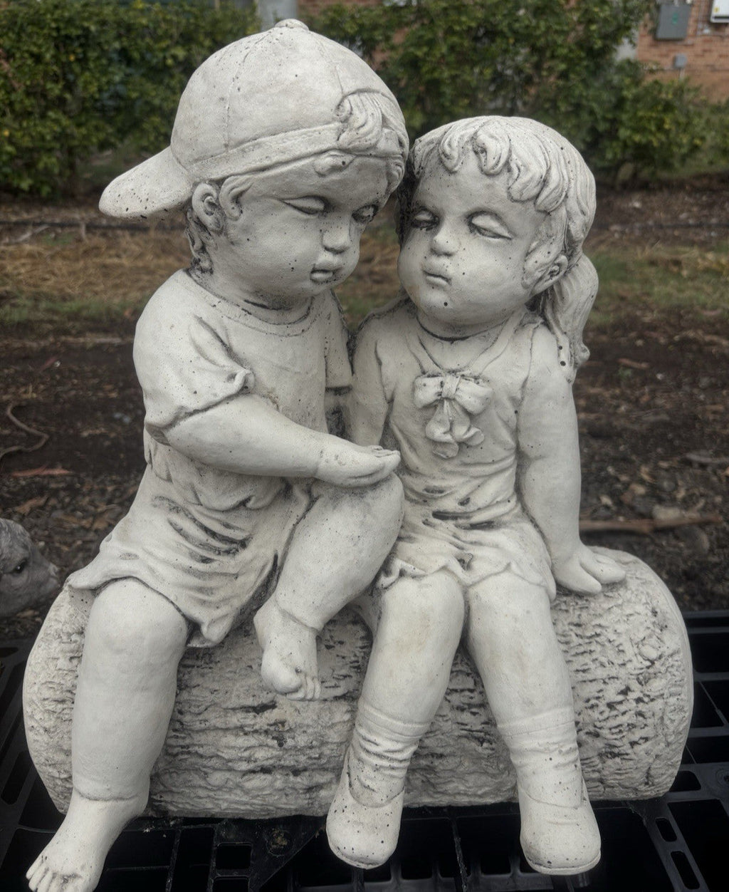22nice4me Garden Statues concrete boy and girl sitting on a log ornament with a natural stone finish