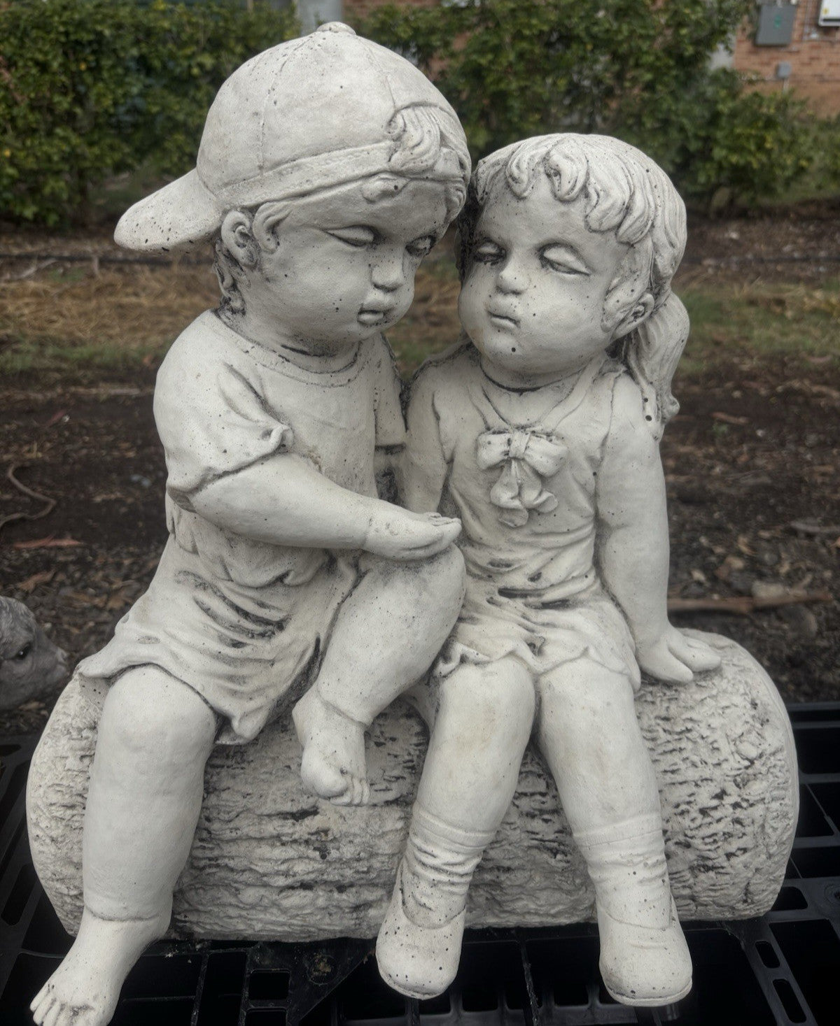 22nice4me Garden Statues concrete boy and girl sitting on a log ornament with a natural stone finish