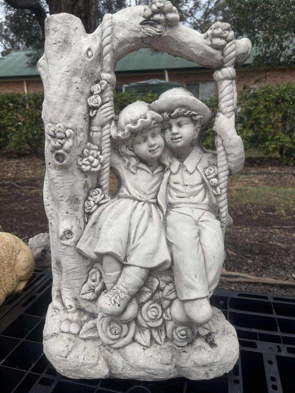 22nice4me Garden Statues concrete boy and girl on a floral swing garden ornament with vintage tree arch design