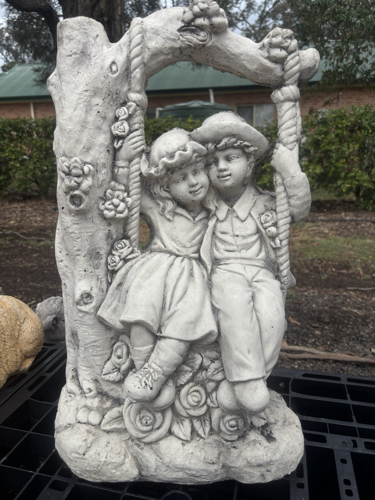 22nice4me Garden Statues concrete boy and girl on a floral swing garden ornament with vintage tree arch design