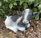 22nice4me Garden Statues hand-painted concrete Holstein Friesian cow ornament resting in a garden setting