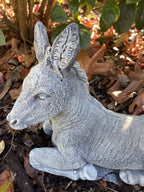 22nice4me Garden Statues hand-painted concrete donkey ornament in a lying position with a textured grey finish.