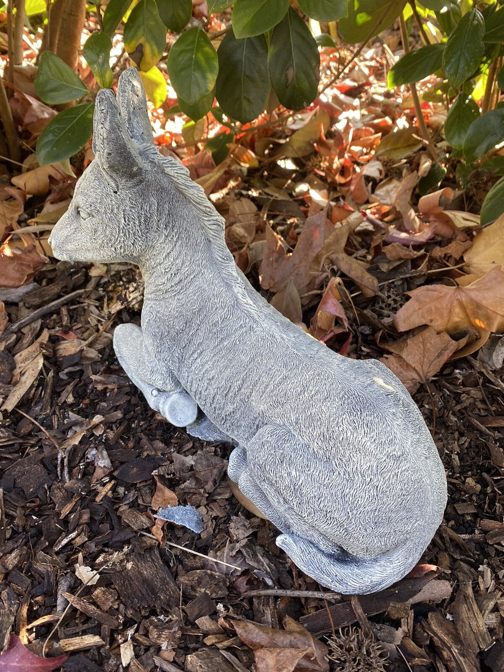 22nice4me Garden Statues concrete donkey ornament in a resting pose with a textured grey finish in a garden setting