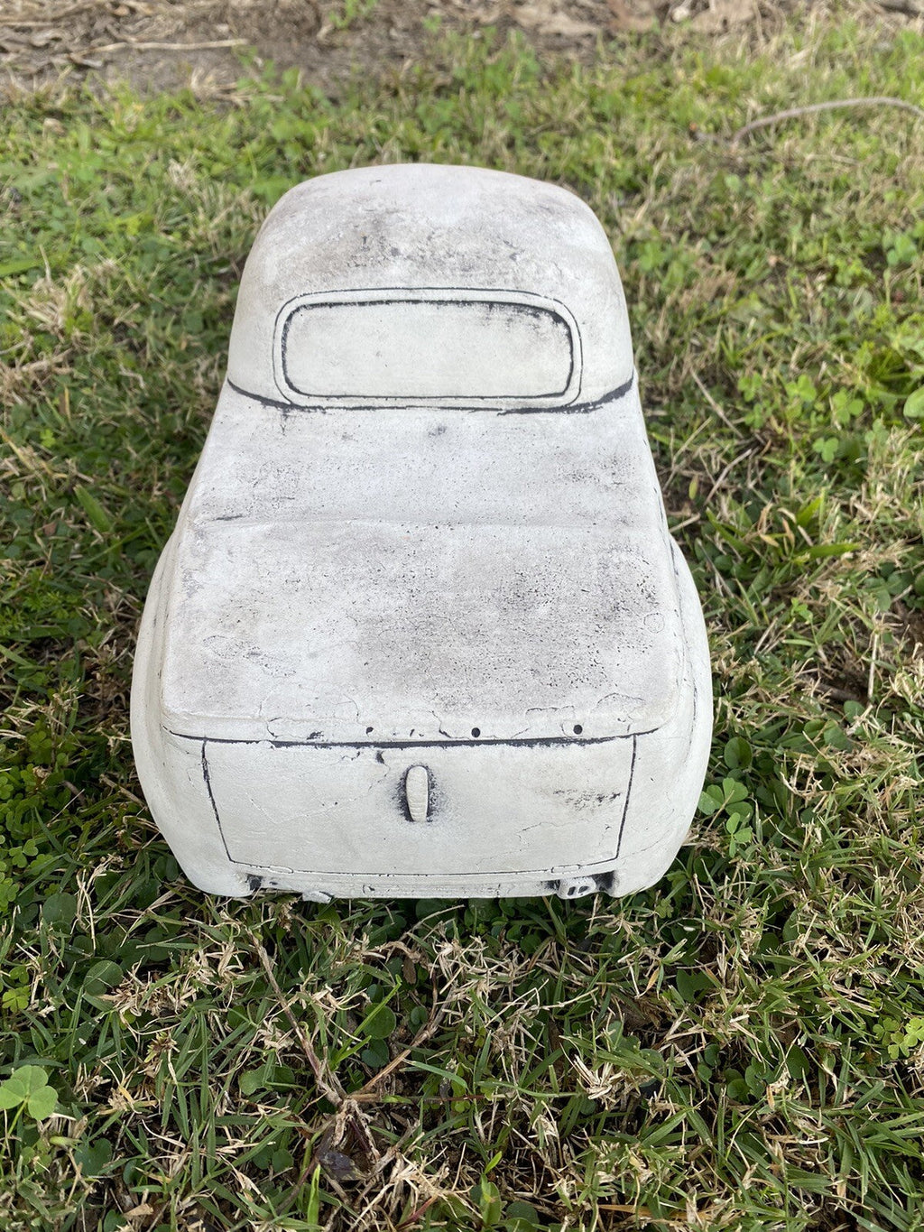 22nice4me Garden Statues 1955 FJ Ute concrete garden ornament with an antique finish, rear view on green grass.