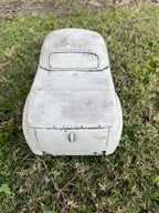 22nice4me Garden Statues 1955 FJ Ute concrete garden ornament with an antique finish, rear view on green grass.