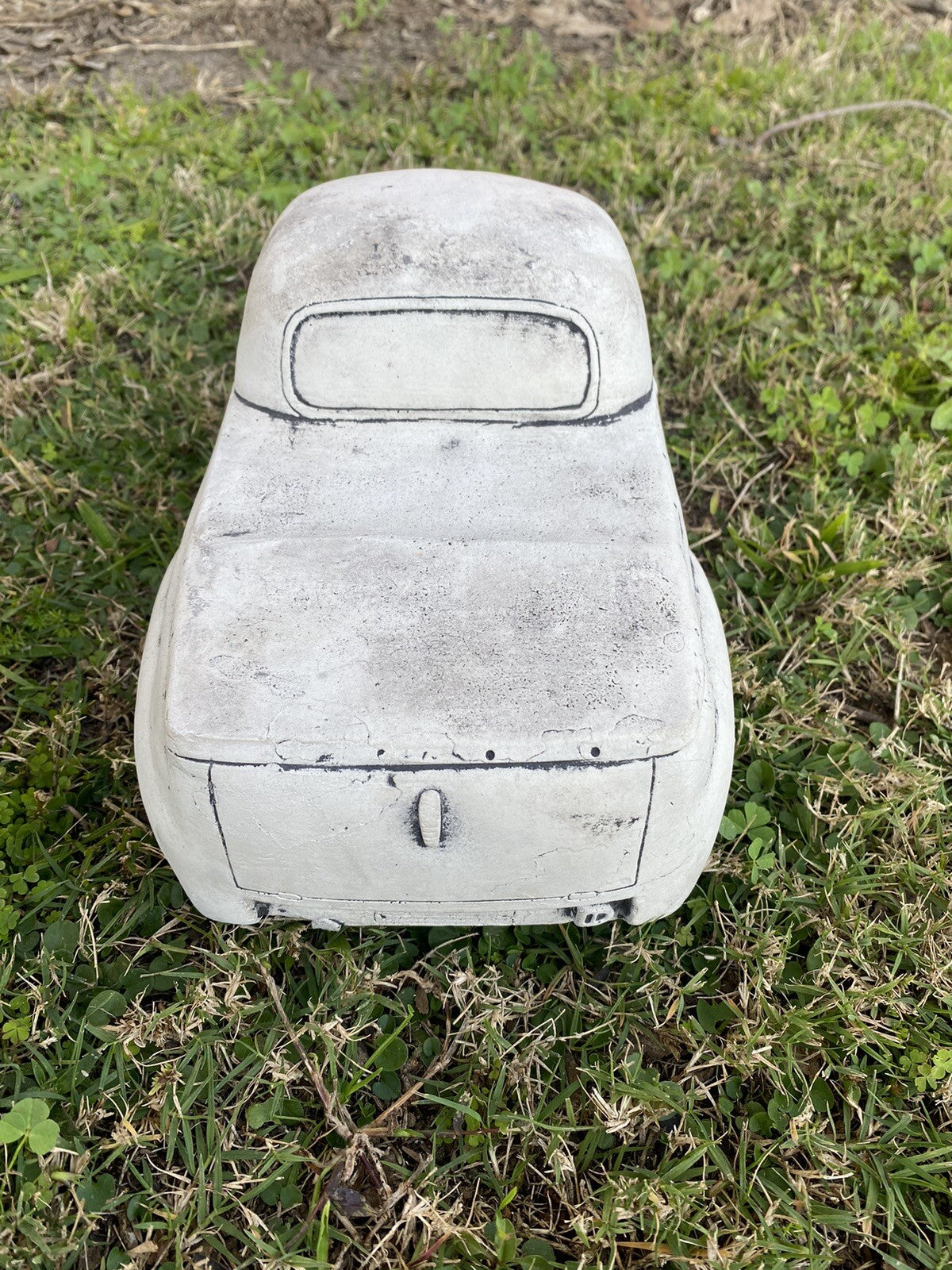 22nice4me Garden Statues 1955 FJ Ute concrete garden ornament with an antique finish, rear view on green grass.