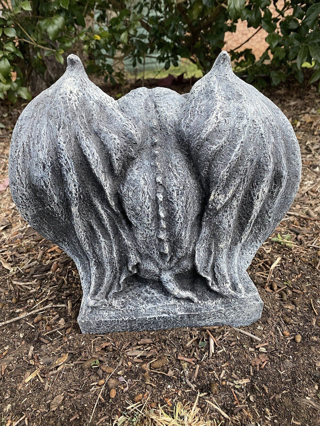 22nice4me Garden Statues concrete gargoyle ornament with an antique rustic finish, back view in a garden setting.