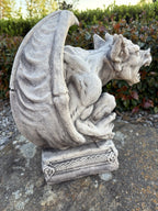 22nice4me Garden Statues concrete gargoyle with detailed wings and horns on a decorative base in a garden setting