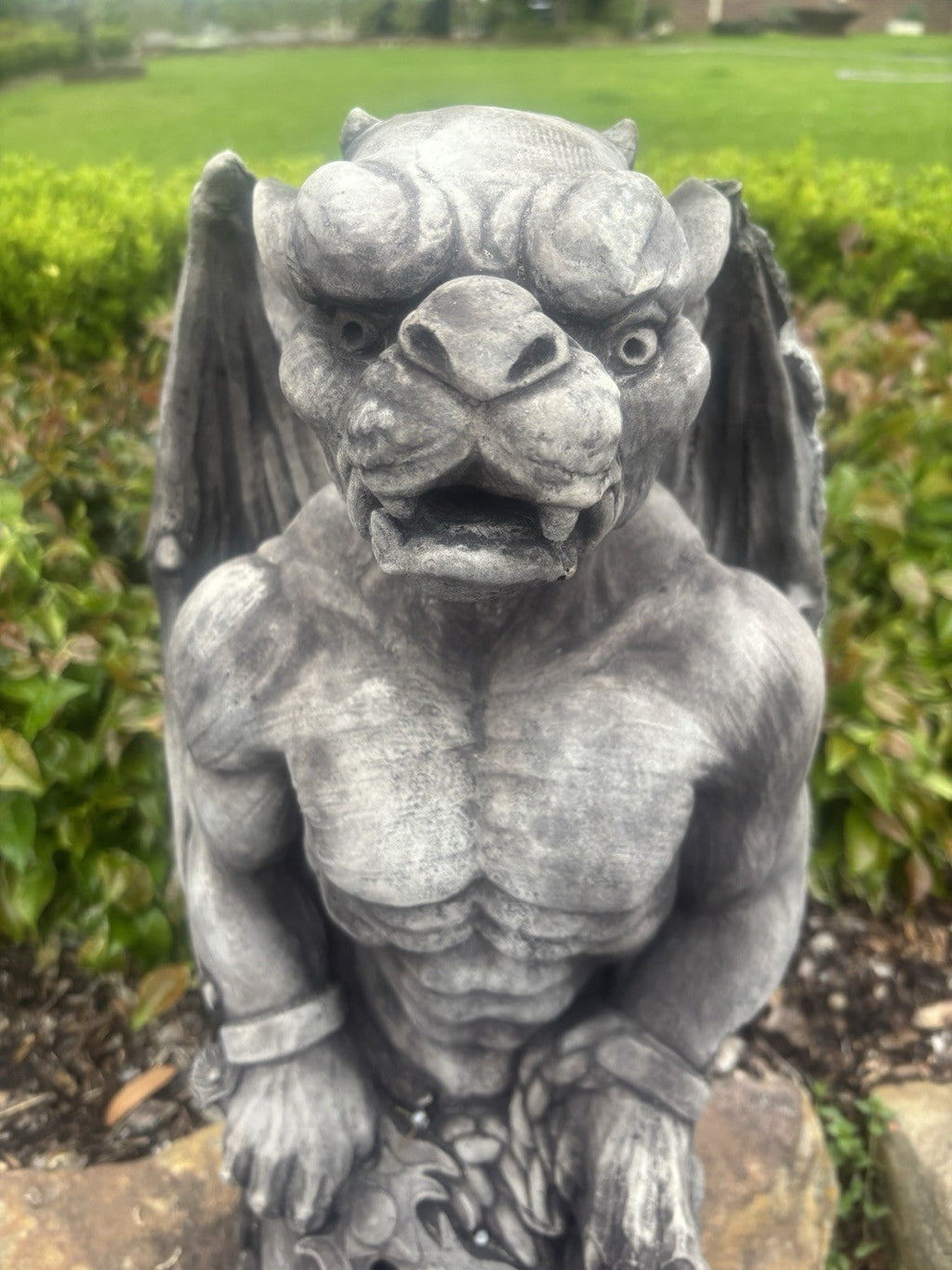 22nice4me Garden Statues concrete gargoyle garden ornament with detailed muscular features in an outdoor setting