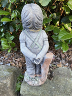 22nice4me Garden Statues concrete girl figure in overalls with braided hair, back view, standing in a garden setting