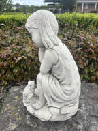 22nice4me Garden Statues concrete girl sitting with a frog, featuring a weathered grey stone finish in a garden setting