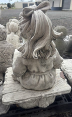 22nice4me Garden Statues concrete girl reading a book statue, back view showing hair detail and rustic bench seat