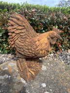 22nice4me Garden Statues concrete hen ornament with a rustic rust finish and detailed feathers on a stump base.
