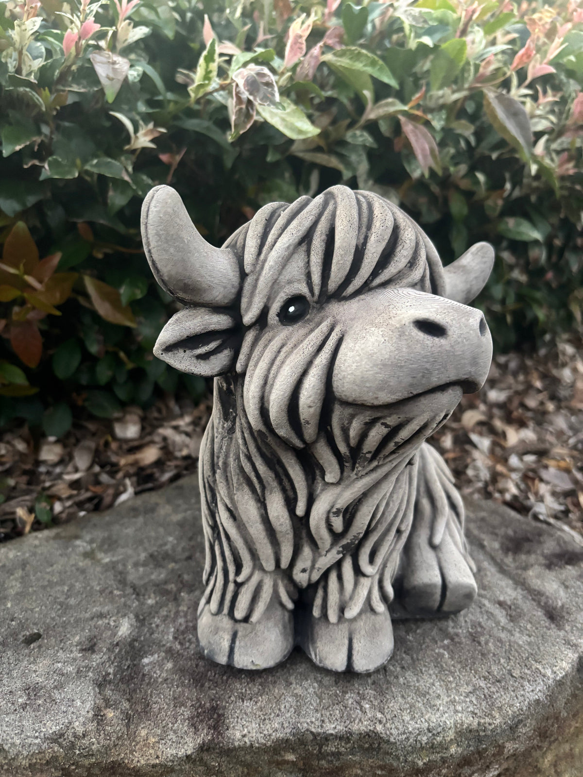 22nice4me Garden Statues rustic concrete Highland cow figurine with shaggy texture, placed on a stone garden path.