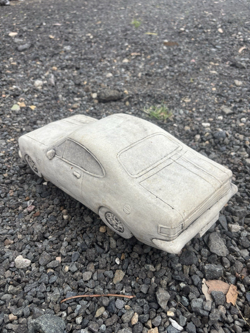22nice4me Garden Statues concrete HK Monaro muscle car ornament with detailed bodywork on a gravel surface