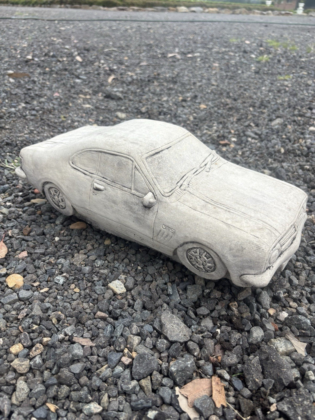 22nice4me Garden Statues concrete HK Monaro car ornament with detailed bodywork and natural grey finish on gravel