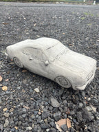22nice4me Garden Statues concrete HK Monaro car ornament with detailed bodywork and natural grey finish on gravel