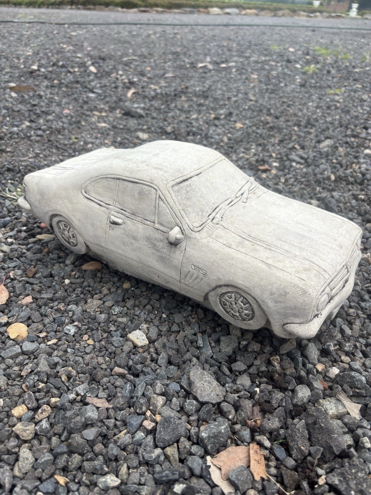 22nice4me Garden Statues concrete HK Monaro car ornament with detailed bodywork and natural grey finish on gravel