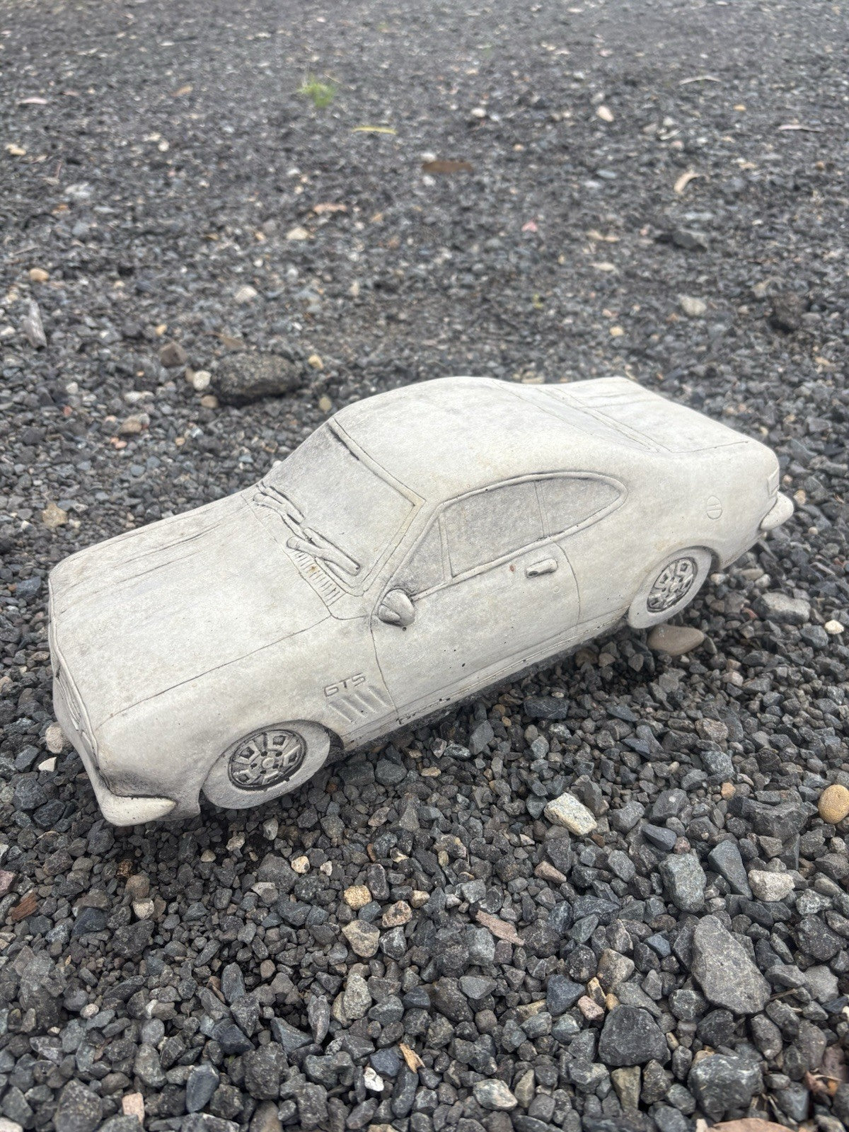 22nice4me Garden Statues concrete HK Monaro car ornament with detailed bodywork and natural grey finish on gravel