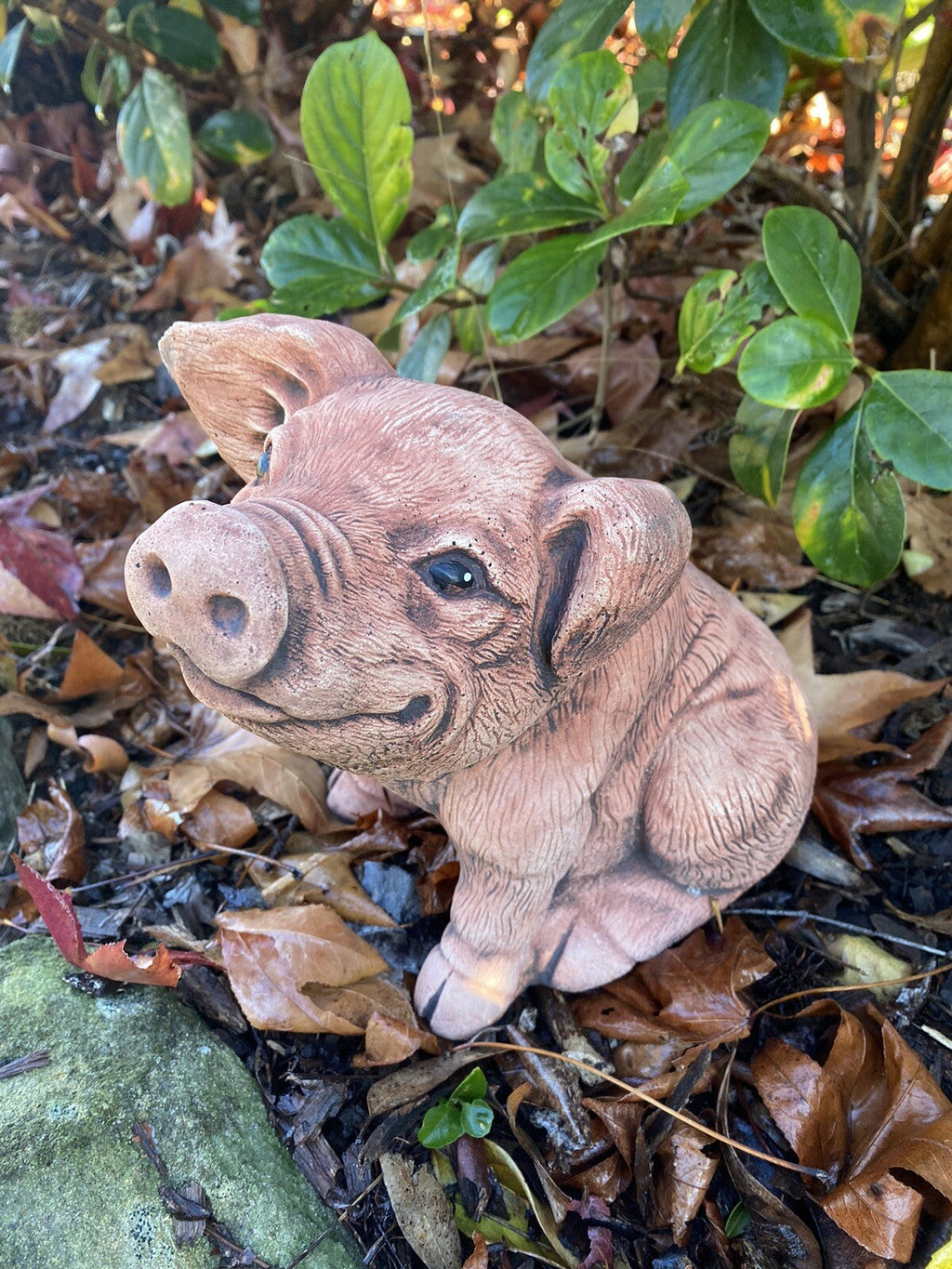 22nice4me Garden Statues hand-painted concrete piglet ornament sitting in a garden setting