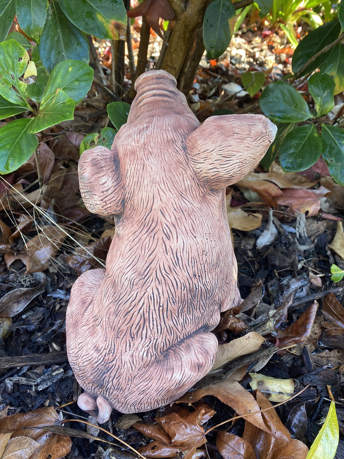 22nice4me Garden Statues hand-painted concrete piglet ornament sitting in a garden setting