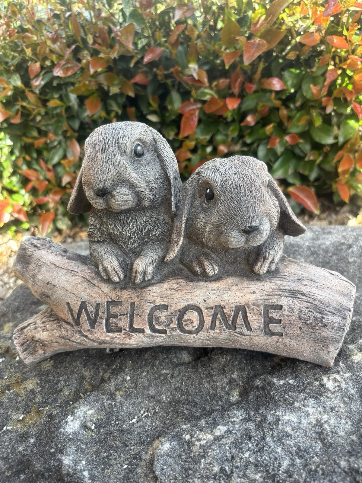22nice4me Garden Statues concrete welcome sign featuring two realistic grey Mini Lop rabbits resting on a log
