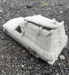 22nice4me Garden Statues concrete Sandman panel van ornament with roof surfboard on a gravel surface