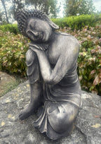 22nice4me Garden Statues concrete sleeping Buddha ornament with a dark weathered finish in a tranquil garden setting