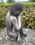 22nice4me Garden Statues concrete sleeping Buddha ornament with a dark weathered finish in a garden setting
