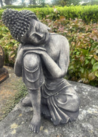 22nice4me Garden Statues concrete sleeping Buddha ornament with a dark weathered finish in a garden setting