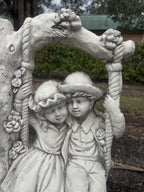 22nice4me Garden Statues concrete boy and girl on a floral swing ornament with vintage tree arch design