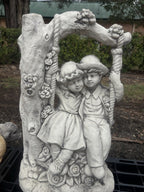 22nice4me Garden Statues concrete boy and girl on a floral swing ornament with vintage tree arch design