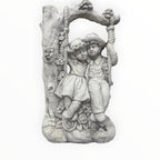 22nice4me Garden Statues concrete boy and girl on a floral swing ornament with tree arch detail in natural white
