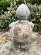 22nice4me Garden Statues concrete turtle ornament with a hand-painted matt finish, viewed from behind in a garden.