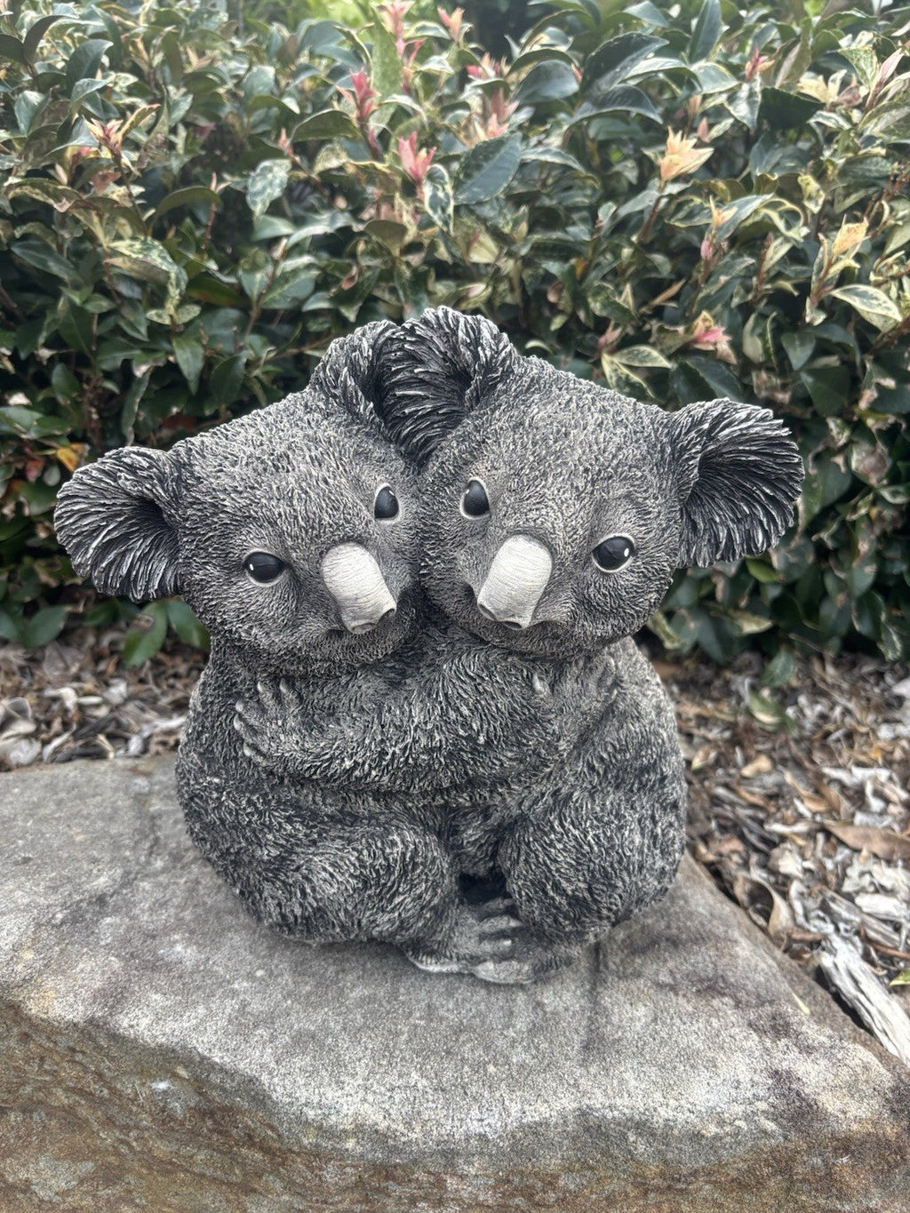22nice4me Garden Statues grey concrete koala cuddling garden ornament with detailed fur texture in a garden setting