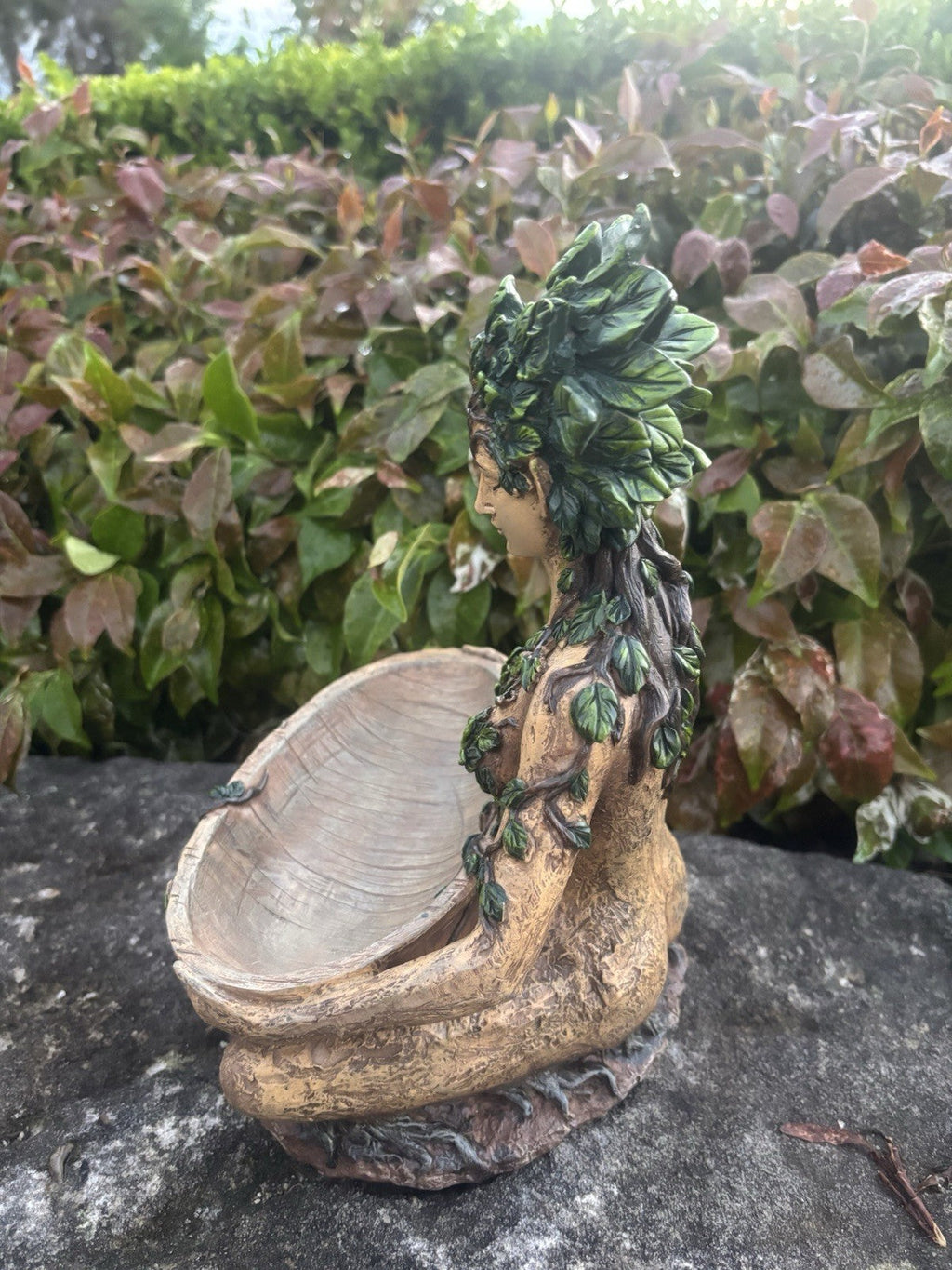 22nice4me Garden Statues resin Gaia goddess planter with green leaf crown and rustic bowl on a stone surface