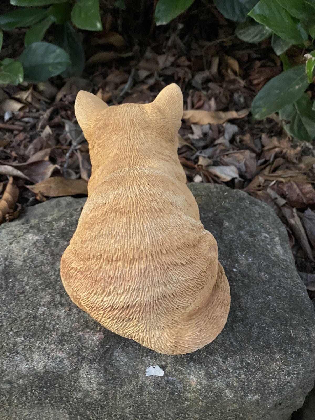 22nice4me Garden Statues ginger tabby cat sleeping statue made of concrete, back view, resting on a garden stone.