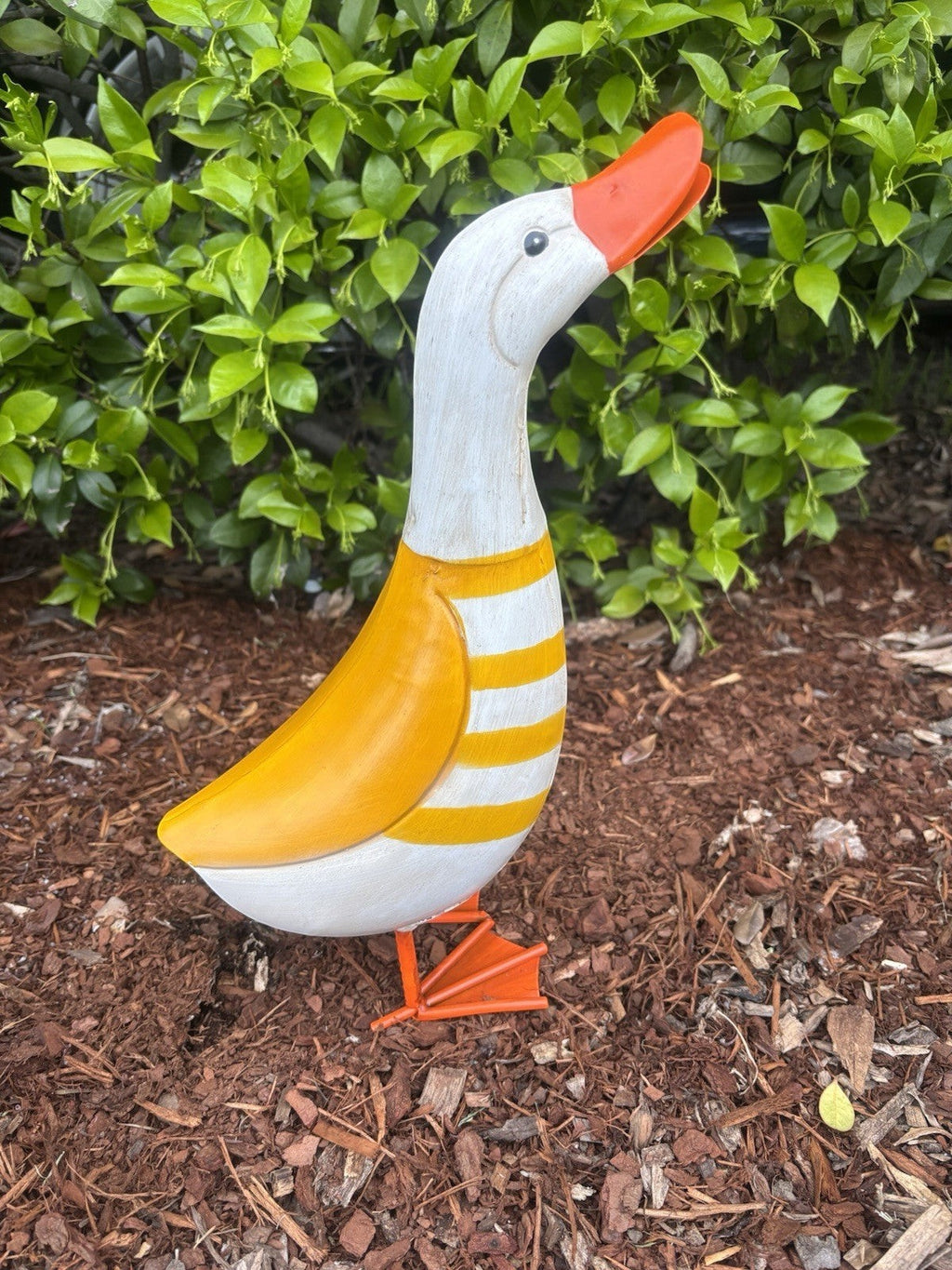 22nice4me Garden Statues metal duck ornament with yellow and white striped body and orange beak in a garden setting