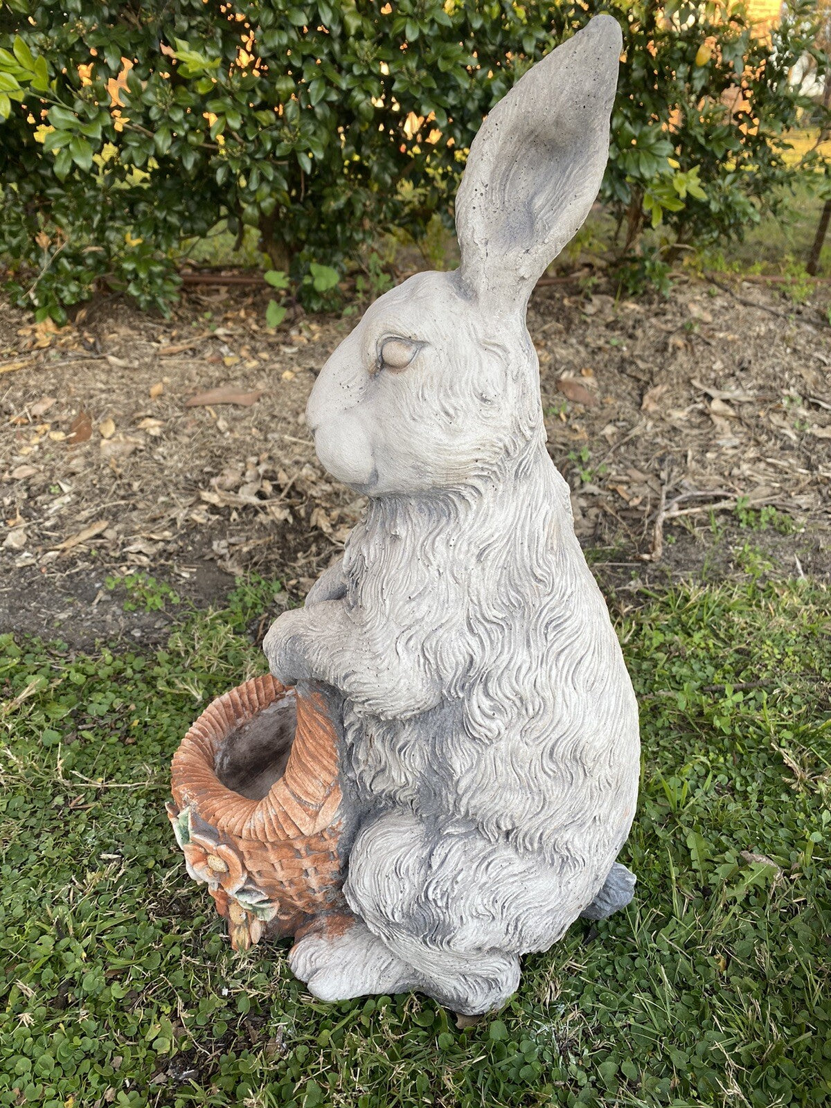 22nice4me Garden Statues rabbit holding a basket planter, hand-painted concrete garden ornament in a grassy setting.