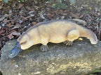 22nice4me Garden Statues resin platypus ornament with realistic hand-painted details, sitting on a stone garden ledge.