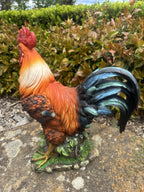 22nice4me Garden Statues resin rooster ornament with vibrant orange, red, and blue-black feathers on a natural base.