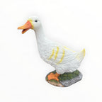 22nice4me Garden Statues white resin duck ornament with orange beak, feet, and yellow feather detailing on a base.